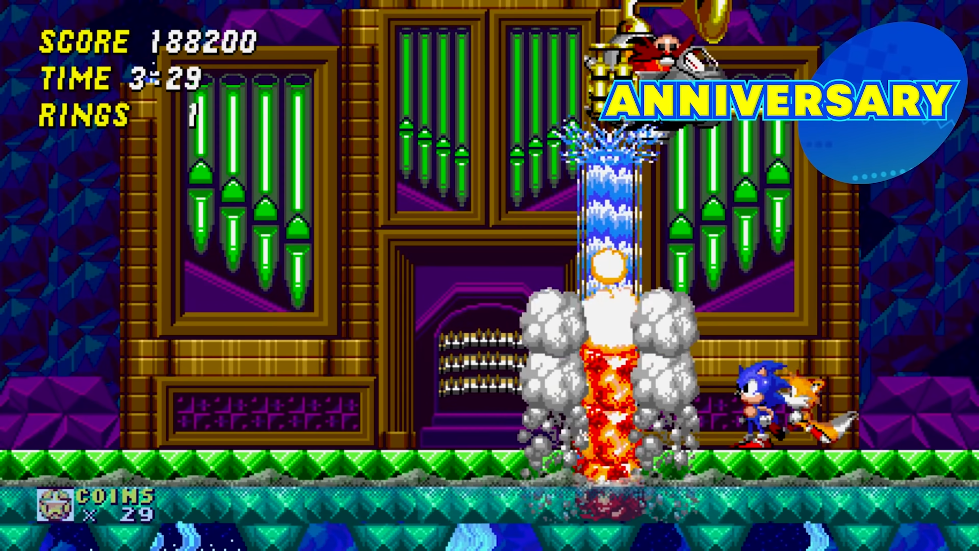 Capture d'écran du boss 1 du monde 1 de Sonic dans sa variante anniversary de Sonic Origins. Le vaisseau de Eggman est différent et le niveau en lui même aussi