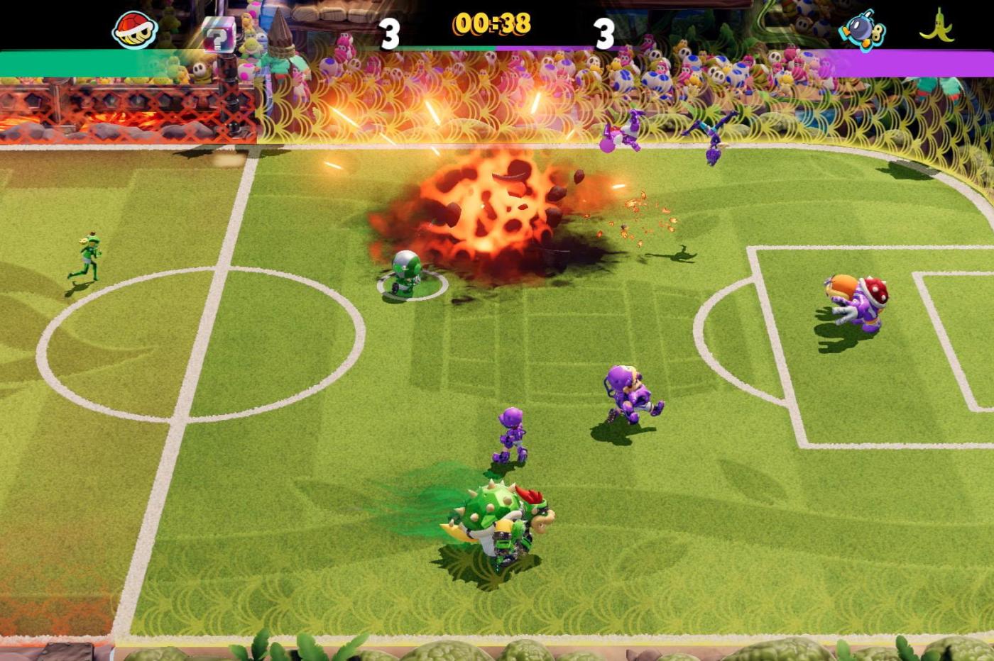 Capture d'écran du jeu en pleine partie alors qu'une explosion de Bom-Omb a lieu sur le terrain