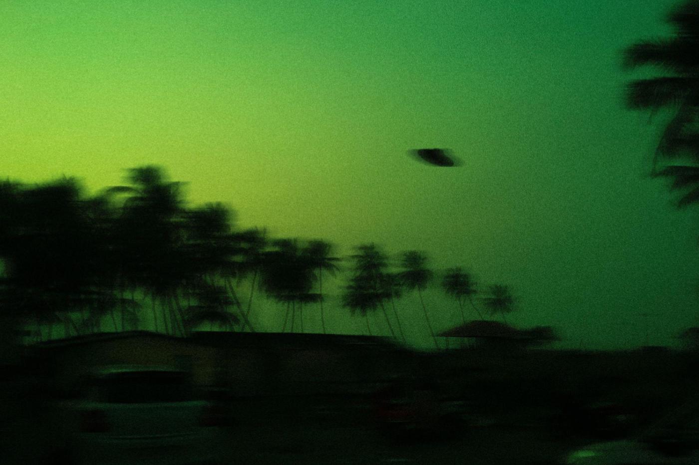 illustrative image of a ufo on a green background