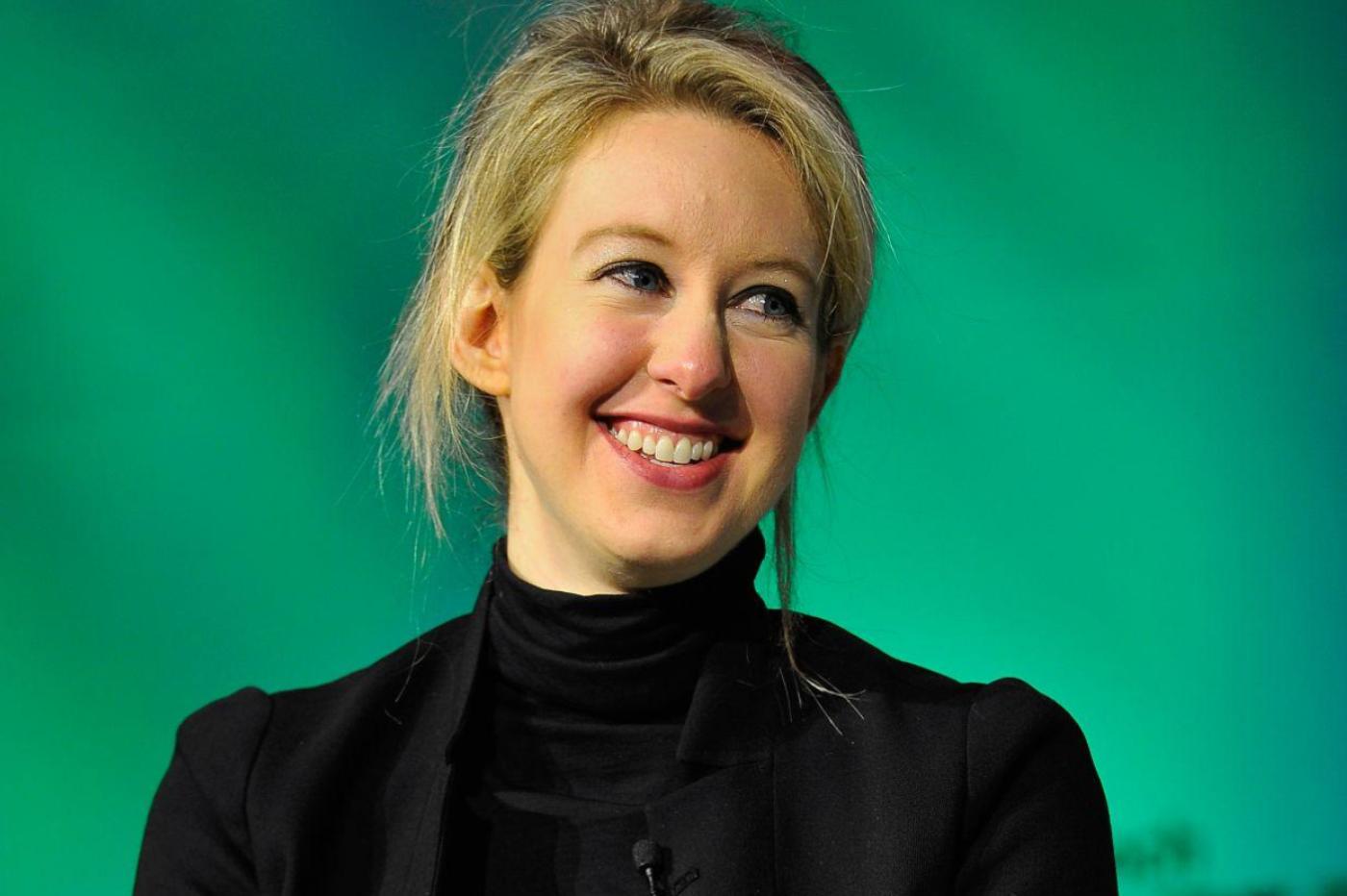 Photo of Elizabeth Holmes smiling at a TechCrunch conference