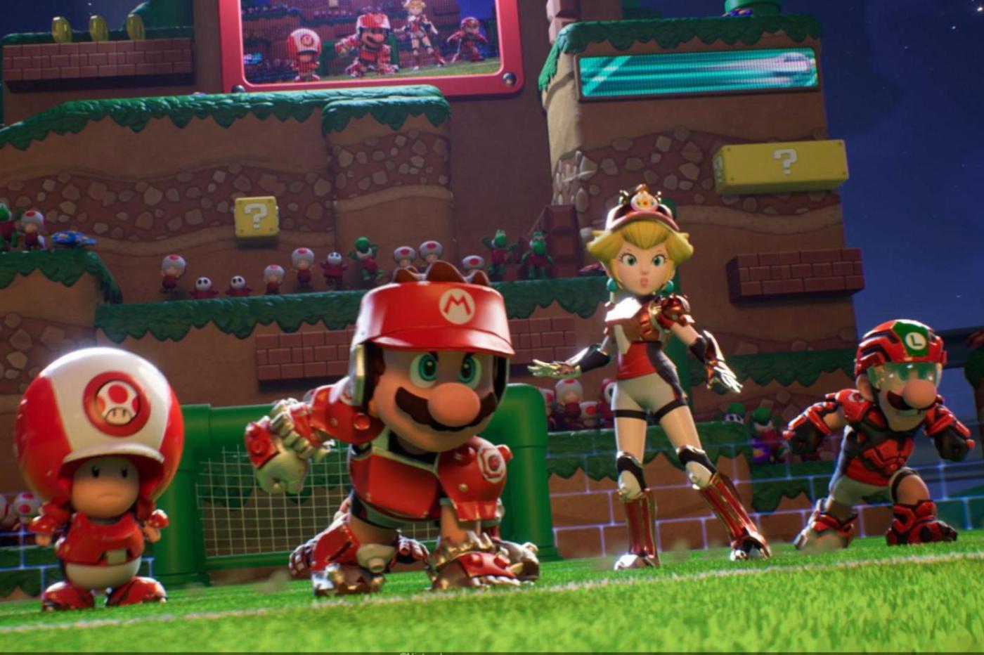 Capture d'écran du trailer de gameplay de Mario Strikers Football pour la Switch montrant Toad, Mario, peach et Luigi en équipements