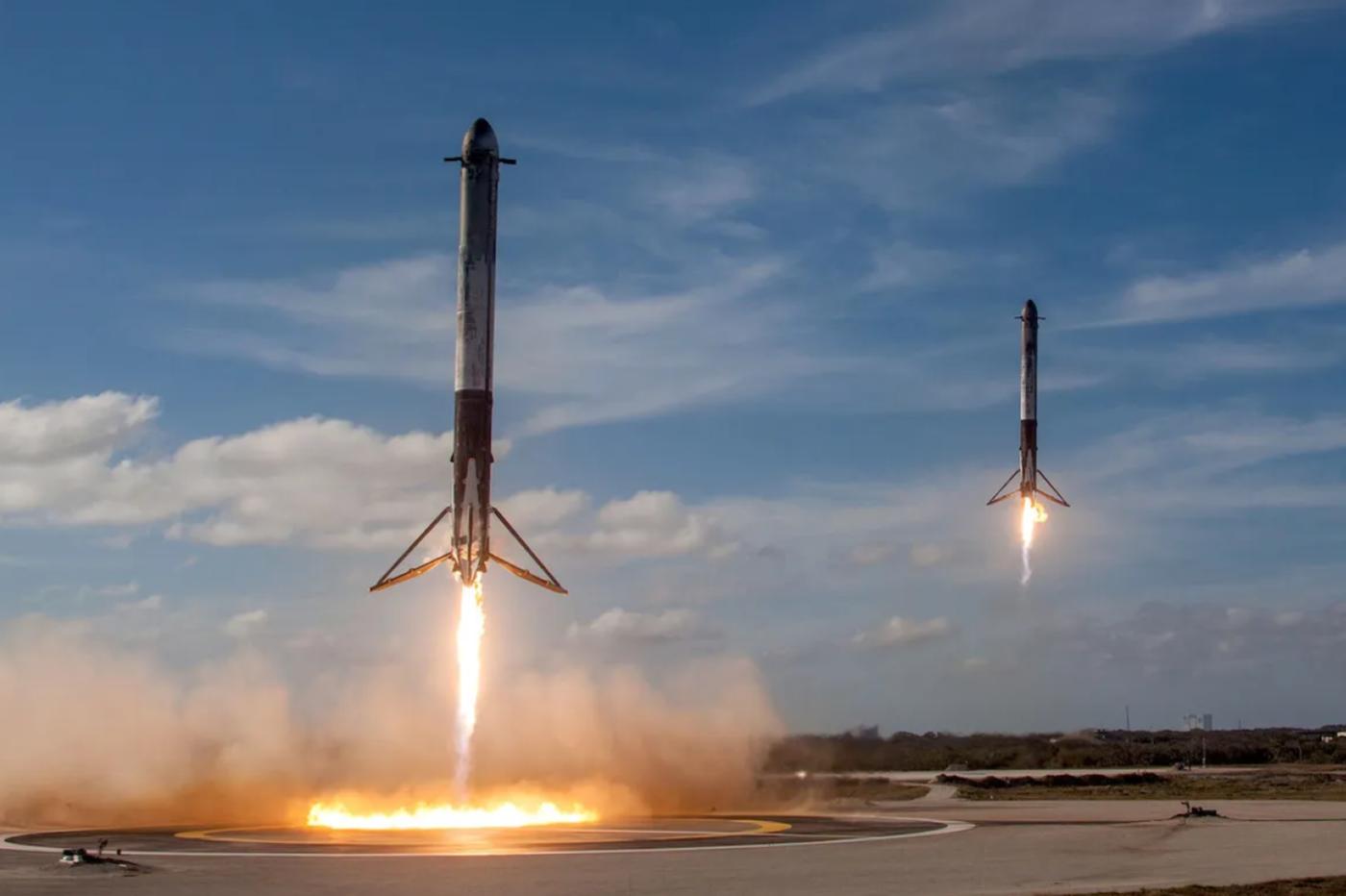 two SpaceX Falcon heavy boosters land at the same time
